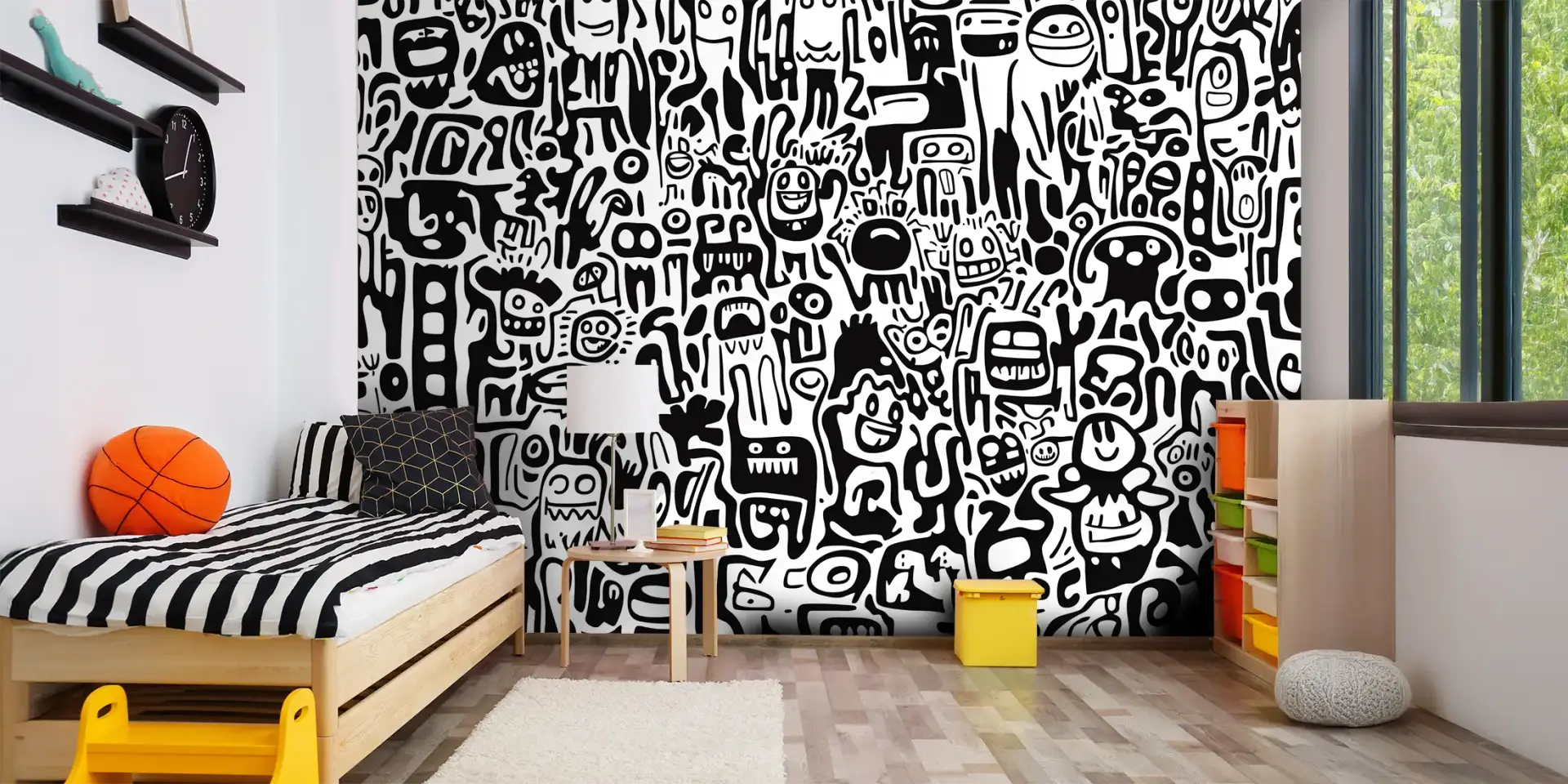 Toile tendue murale P'tits monstres noir et blanc, posée dans un intérieur